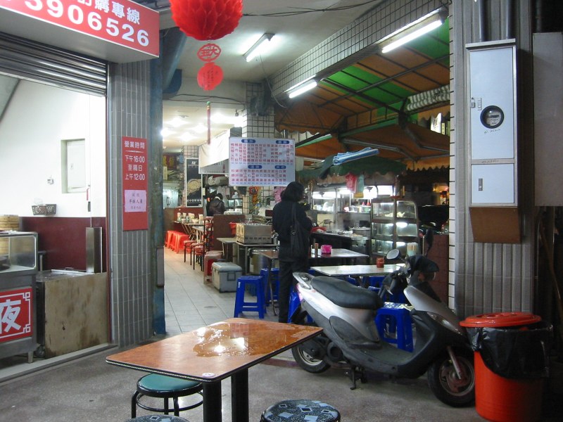 A cafe stall in front of a shop